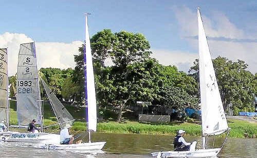 Competitors in Saturday’s Club Pointscore Series keep a close eye on a storm. Competitors in Saturday’s Club Pointscore Series keep a close eye on a storm.